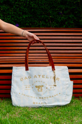 Bolsa Wallow Azul com Alça de Couro Marrom