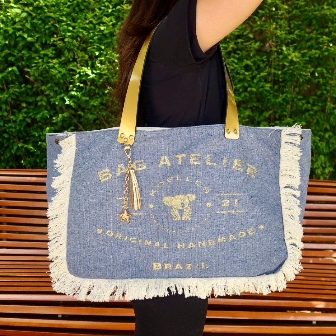 Bolsa Wallow Jeans Claro com Alça de Couro Dourado