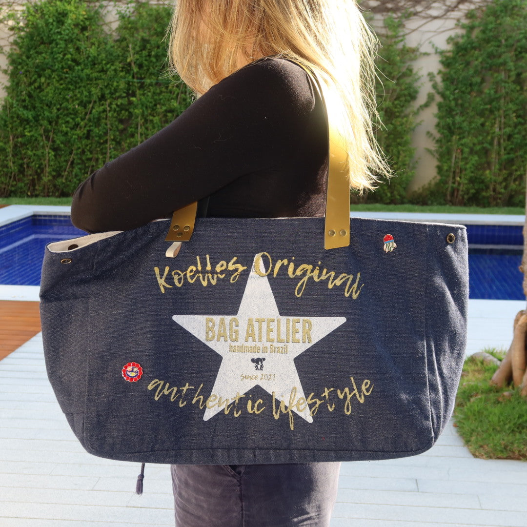 Bolsa Wallow Jeans Escuro com Alça de Couro Dourado
