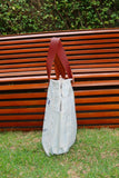 Bolsa Wallow Azul com Alça de Couro Marrom