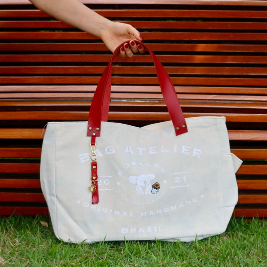 Bolsa Wallow Azul com Alça de Couro Vermelha