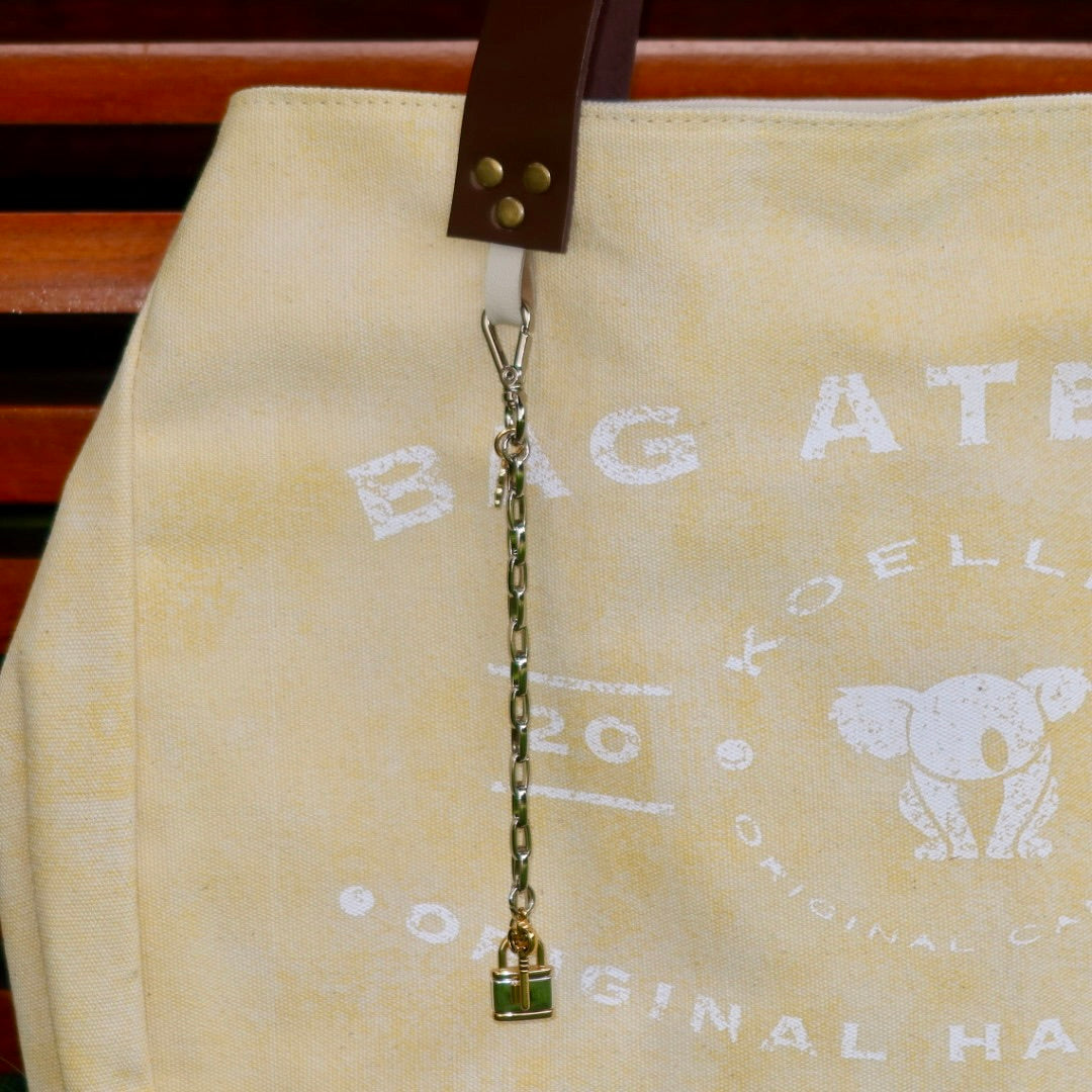 Bolsa Wallow Amarela com Alça de Couro Marrom Escuro