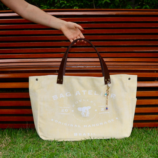 Bolsa Wallow Amarela com Alça de Couro Marrom Escuro