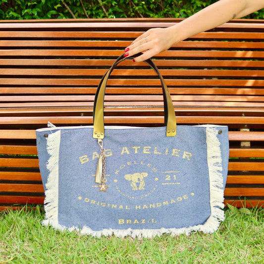 Bolsa Wallow Jeans Claro com Alça de Couro Dourado