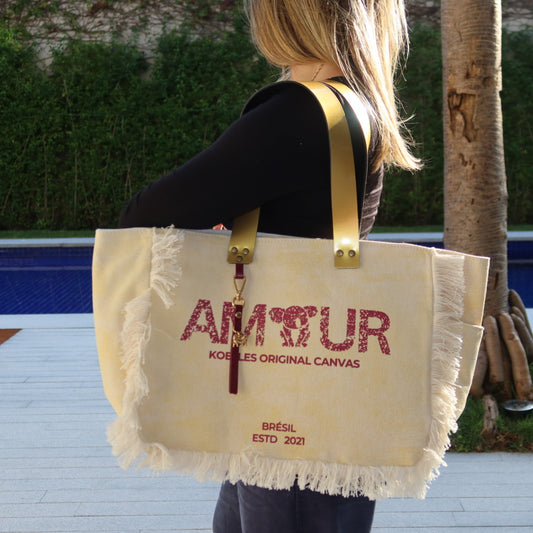 Bolsa Nuna Amarela com Alças de Couro Dourada