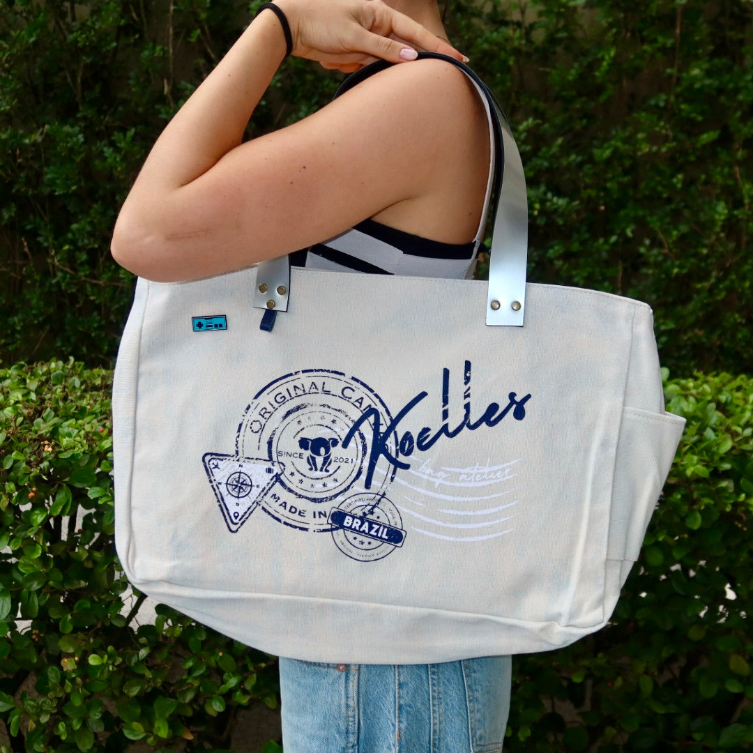 Bolsa Wallow Azul com Alça de Couro Prata