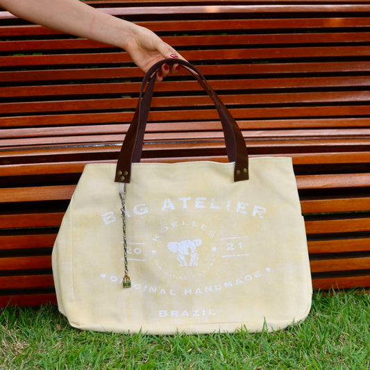 Bolsa Wallow Amarela com Alça de Couro Marrom Escuro