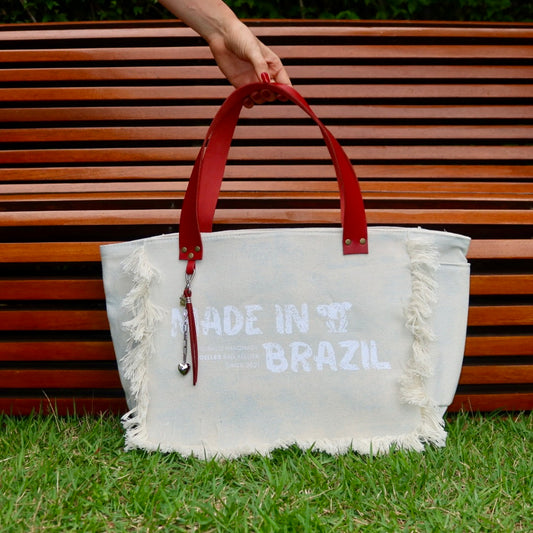 Bolsa Nuna Azul com Alças de Couro Vermelha