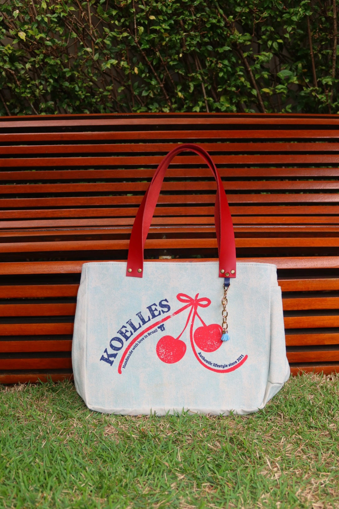 Bolsa Nuna Aqua com Alças de Couro Vermelho