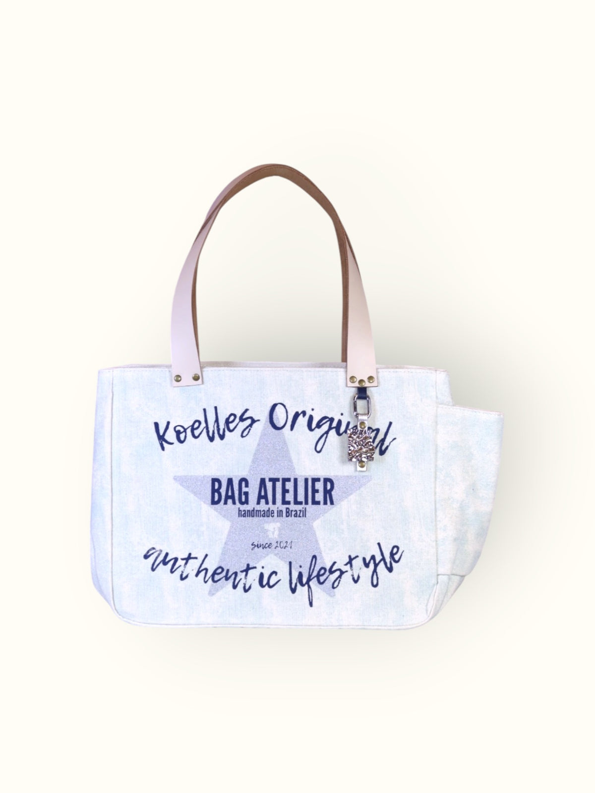 Bolsa Nuna de lona aqua com alças de couro off white