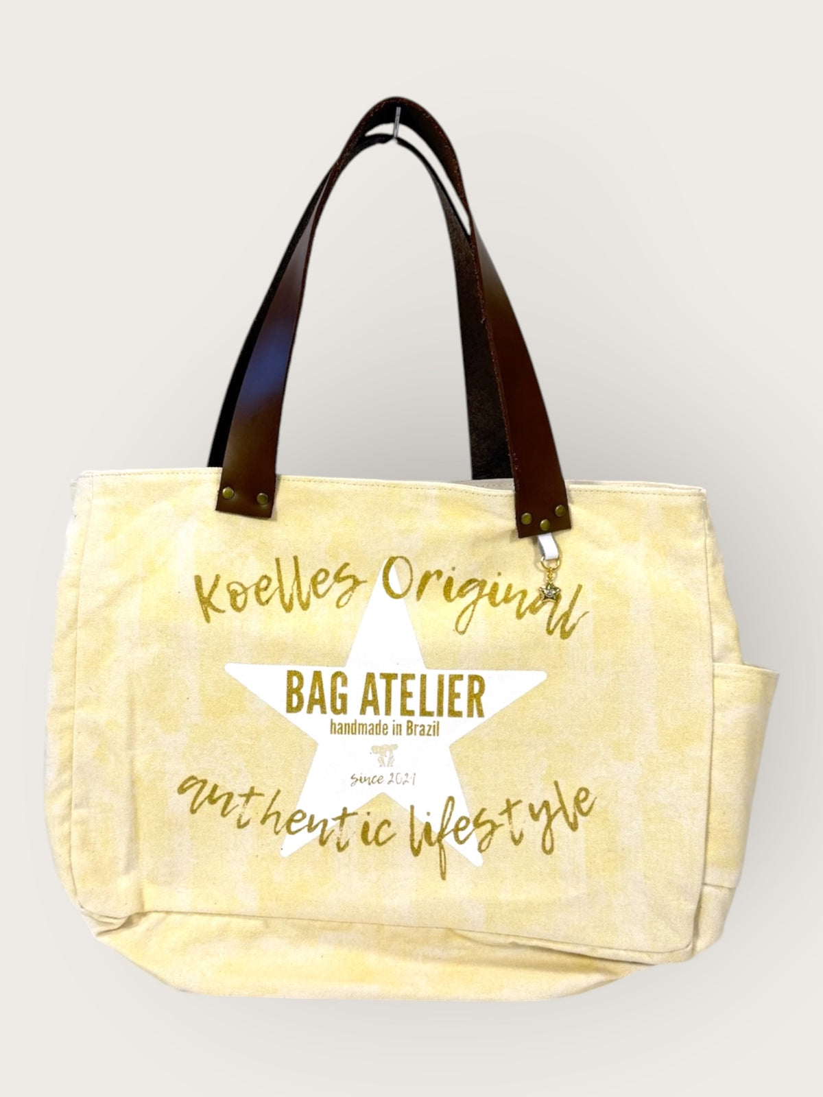 Bolsa Wallow Amarela com Alça de Couro Marrom Escuro